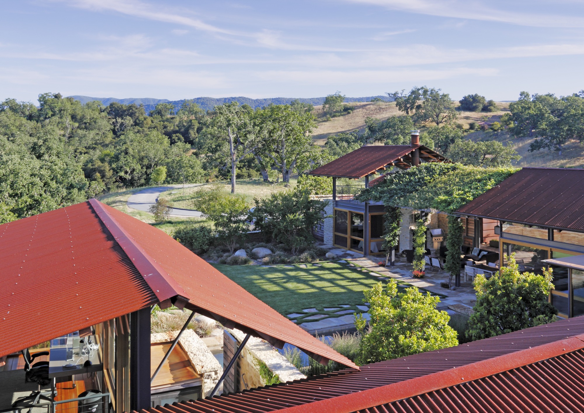 Aerial rendering view of a courtyard house with indoor-outdoor rooms. 