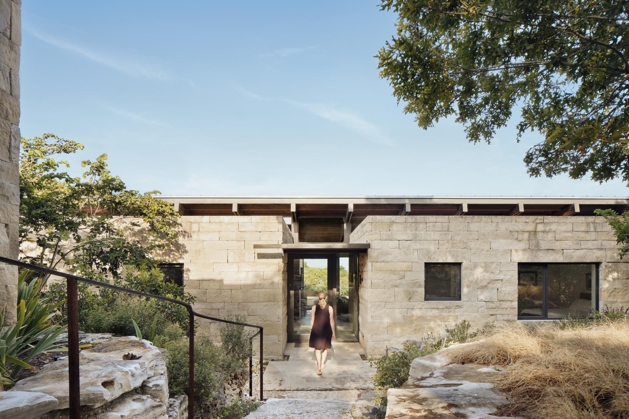 Canyon Preserve stair step down steep, rocky slopes of oaks and indigenous vegetation, creating a secluded and serene setting for this intimate house