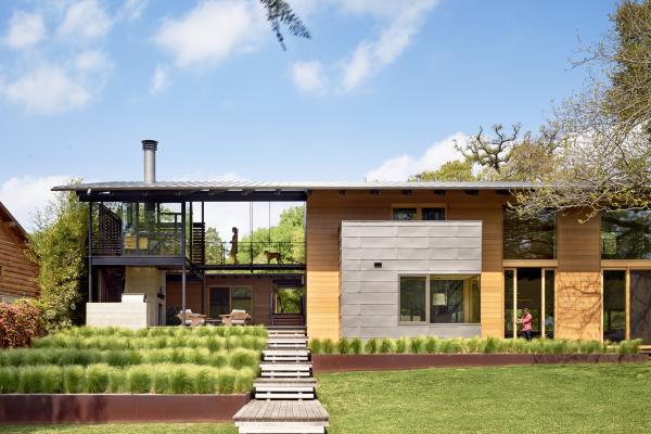 Situated at the confluence of Hog Pen Creek and Lake Austin, Hog Pen Creek Residence was envisioned by its owners as a place that evokes the playfulness of summer on the lake and emphasizes exterior living space. Towering heritage oak trees, a steeply slo