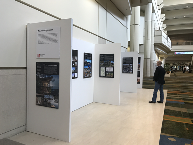 AIA exhibited boards featuring recognized projects from various awards programs.